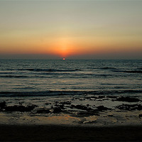 Buy canvas prints of sunset at Anjuna beach goa by Natasha Coutinho