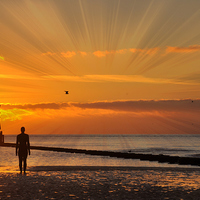 Buy canvas prints of gormley sunset by sue davies