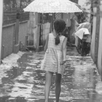 Buy canvas prints of Girl In Rain by Clive Eariss