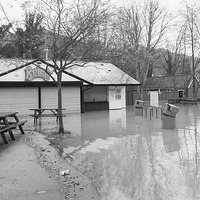 Buy canvas prints of FLOODED RYKAS CAFE by Clive Eariss