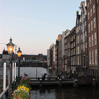 Buy canvas prints of Canal in Amsterdam by Emma Finbow