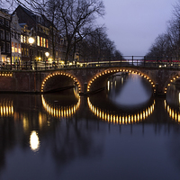 Buy canvas prints of Cycle Light Trails in Amsterdam by Ann Garrett