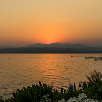 Buy canvas prints of Lake Garda Sunset by Ann Garrett