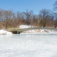 Buy canvas prints of Bow Bridge in Central Park in the Snow by Ann Garrett