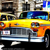 Buy canvas prints of NEW YORK TAXI IN LONDON by David Atkinson