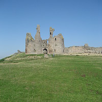 Buy canvas prints of Dunstanburgh Castle Northumbreland by angela morris