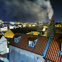 Buy canvas prints of Whitby Smoking Chimney Rooftops at Night by Paul M Baxter