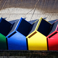 Buy canvas prints of Whitby Beach Huts in Sun and Shadow  by Paul M Baxter