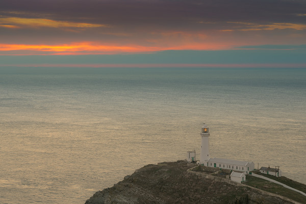 Lighthouse at Sunset,South Stack, Anglesey Picture Board by Natures' Canvas: Wall Art  & Prints by Andy Astbury
