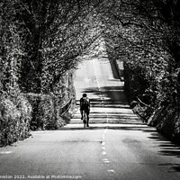 Buy canvas prints of The Lone Cyclist by Julie Ormiston