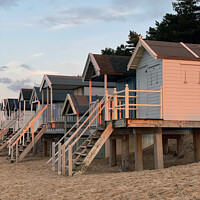 Buy canvas prints of Beach huts at sunset on Holkham beach by suzie Attaway
