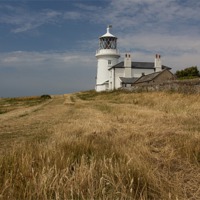 Buy canvas prints of Caldey Island Lighthouse by nick hirst