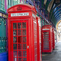 Buy canvas prints of Red Telephone Boxes by Philip Pound
