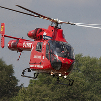 Buy canvas prints of  Red London Air Ambulance Helicopter by Philip Pound
