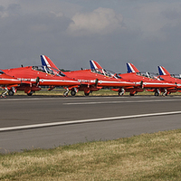 Buy canvas prints of  Red Arrow Jets Parked on the Runway at Biggin Hil by Philip Pound