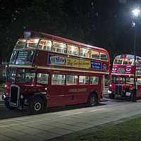Buy canvas prints of Two Veteran London Double Decker Red Buses at Nigh by Philip Pound