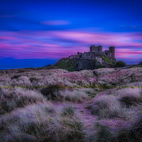 Buy canvas prints of Dreamy Bamburgh Castle at Sunset by Philip Pound