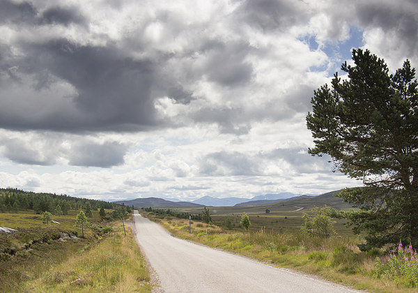  Clouds above remote Highland Road Picture Board by Derek Corner