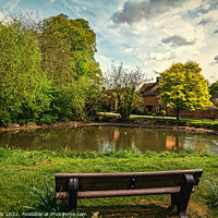 Buy canvas prints of A Seat By The Village Pond by Ian Lewis