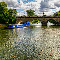 Buy canvas prints of A Blue Narrowboat at Wallingford Bridge by Ian Lewis