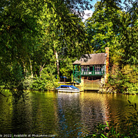 Buy canvas prints of A Picturesque Boathouse Near Benson by Ian Lewis