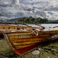 Buy canvas prints of Boats on the Lakeside  at Derwentwater by Ian Lewis