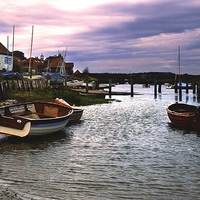 Buy canvas prints of Evening at Burnham Overy Staithe by Ian Lewis