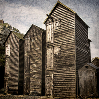 Buy canvas prints of Fishermens Huts at Hastings by Ian Lewis