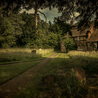 Buy canvas prints of Cottage In The Churchyard by Ian Lewis