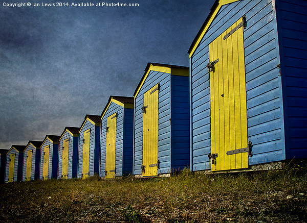  Blue and Yellow Beach Huts Picture Board by Ian Lewis