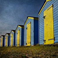 Buy canvas prints of  Blue and Yellow Beach Huts by Ian Lewis