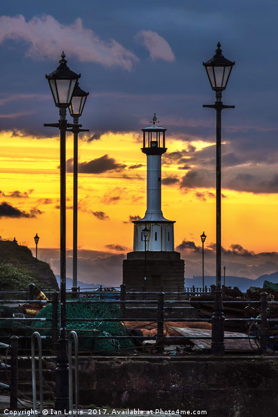 Maryport Lighthouse At Sunset Picture Board by Ian Lewis