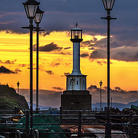 Buy canvas prints of Maryport Lighthouse At Sunset by Ian Lewis