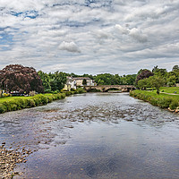 Buy canvas prints of River Derwent Flowing Through Cockermouth by Ian Lewis