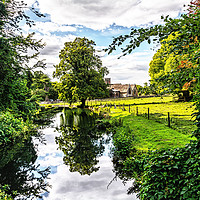 Buy canvas prints of Lockinge Brook and the Parish Church by Ian Lewis