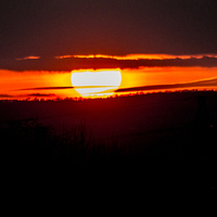 Buy canvas prints of  sun setting on wales by keith sutton