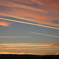 Buy canvas prints of Jet Streams Sunset 2 by Roger Stevens