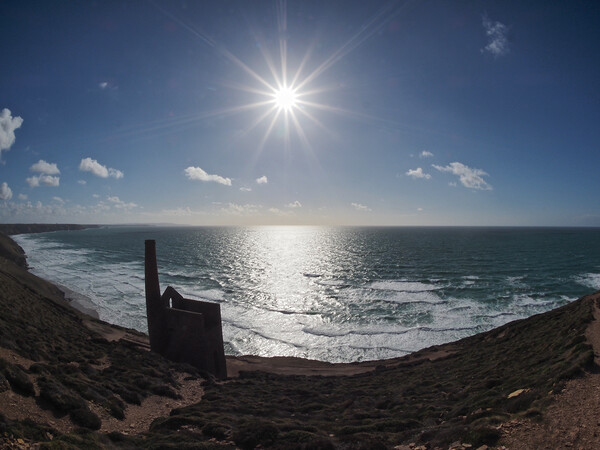 Sun shining over Wheal Coates ruins coast path Picture Board by mark humpage
