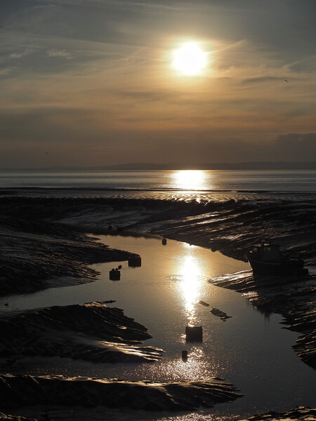 Golden Sunset over water at Clevedon harbour, Somerset. Picture Board by mark humpage
