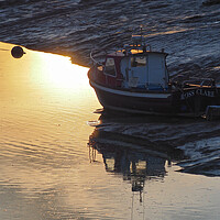 Buy canvas prints of Golden Sunset with boat in water at Clevedon harbour, Somerset. by mark humpage