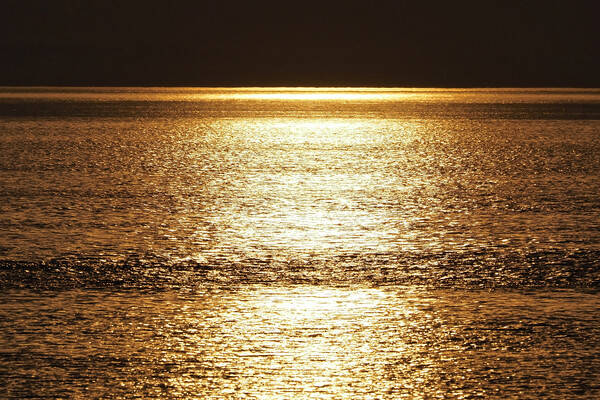 Golden Sunset over water at Clevedon Somerset. Picture Board by mark humpage