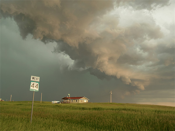 Storm clouds above house Picture Board by mark humpage