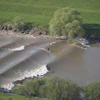 Buy canvas prints of Surfers on the Severn Bore Aerial by mark humpage