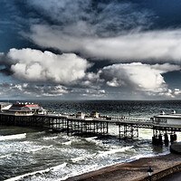 Buy canvas prints of Cromer Pier with sun and clouds by mark humpage