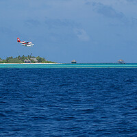 Buy canvas prints of Maldives Islands with sea plane landing by mark humpage