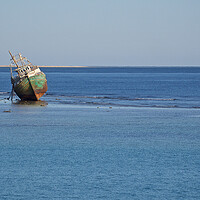 Buy canvas prints of Shipwreck stranded in sea with beach by mark humpage