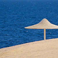 Buy canvas prints of Beach sand sea and parasol Egypt by mark humpage