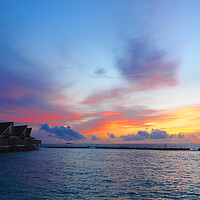 Buy canvas prints of Sunset sea view over Maldives water bungalows  by mark humpage