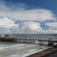 Buy canvas prints of Cromer Pier with lifeboat sun and clouds by mark humpage