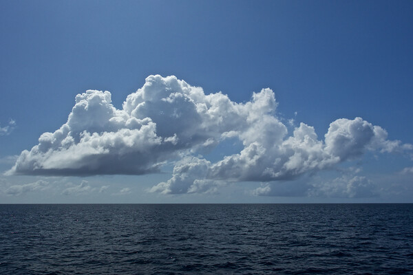 Clouds over sea in Maldives Picture Board by mark humpage